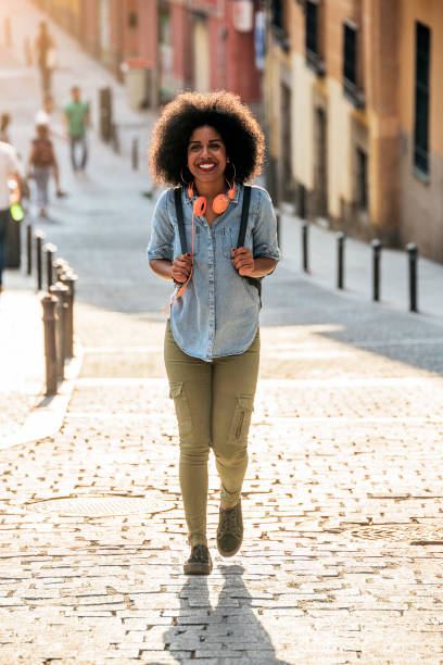 istock Beautiful afro american woman walking. 938996136
