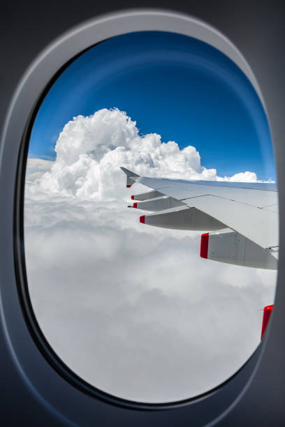 istock View of an airplane wing out the window 938996302