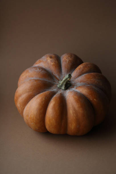 istock Fresh pumpkin on dark background, food closeup 938999518