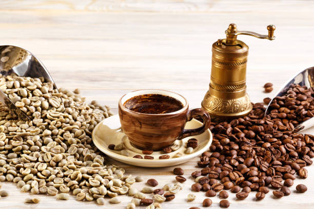 istock cup of coffee with the coffee grinder and coffee seeds 939005730