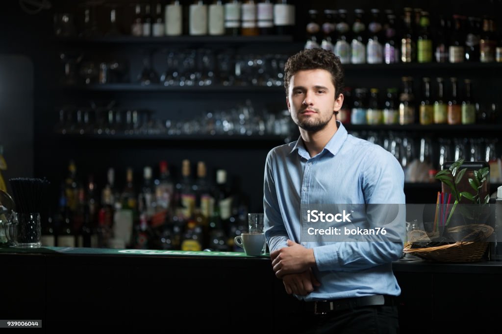 Young businessman at bar counter Manager Stock Photo