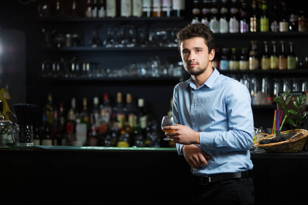 istock Young businessman at bar counter 939006338