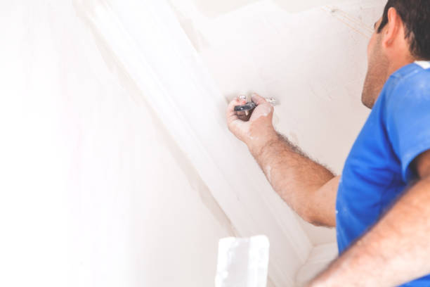 istock Caucasian man making repair in room. 939008884