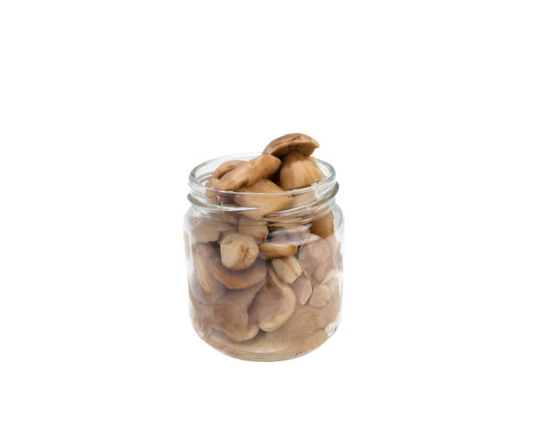 istock Canned mushrooms on a white background 939010874
