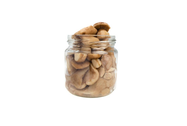 istock Canned mushrooms on a white background 939010882