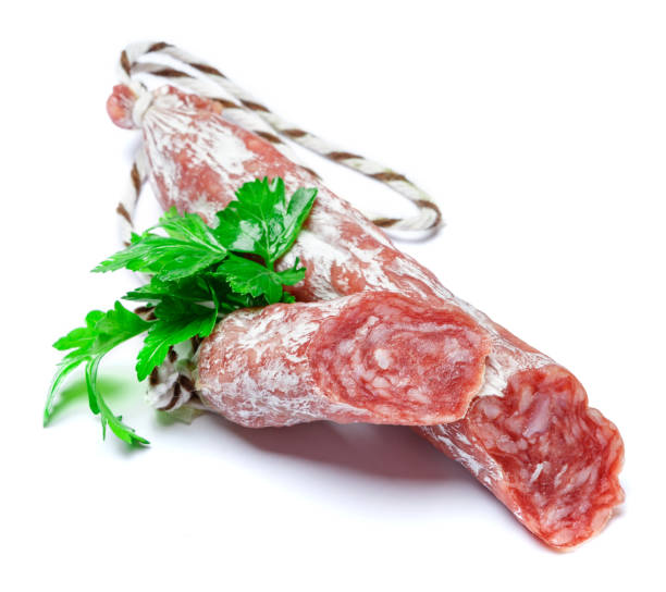 istock Dried sliced organic salami sausage on white background 939016610