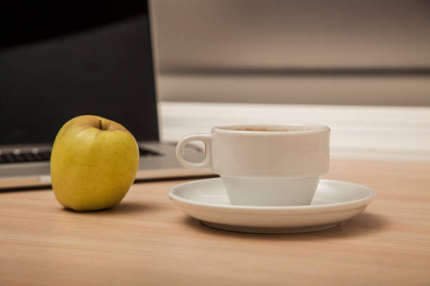 istock desk view in the office, computer and coffee, front view 939017160