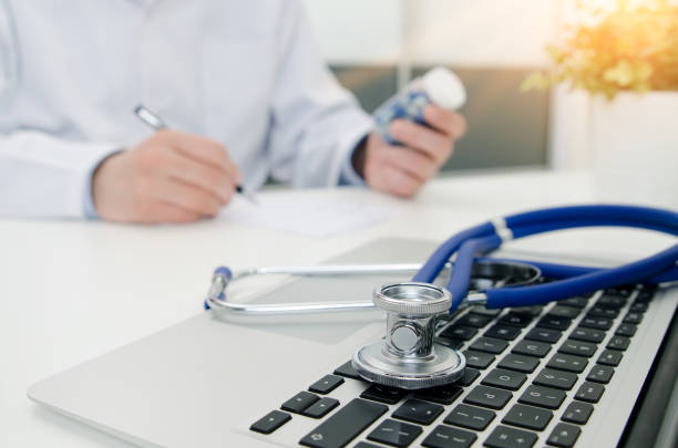 istock Doctor working in hospital. Stethoscope on laptop keyboard 939017202
