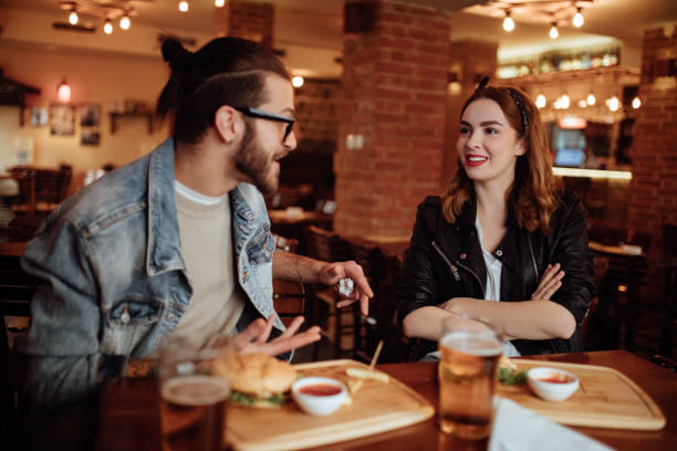 istock Couple having fun at local pub 939023014