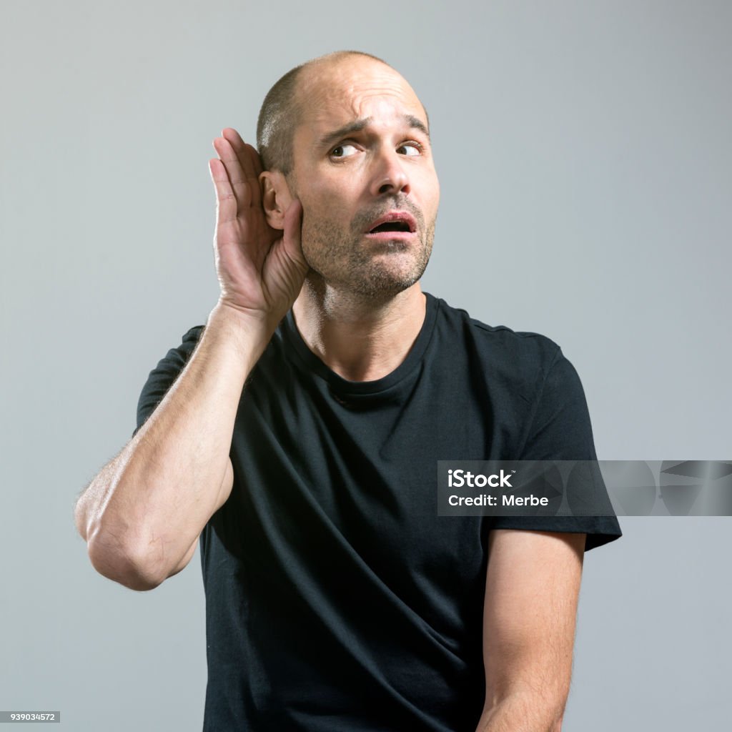 how do you say man trying to listen Deafness Stock Photo