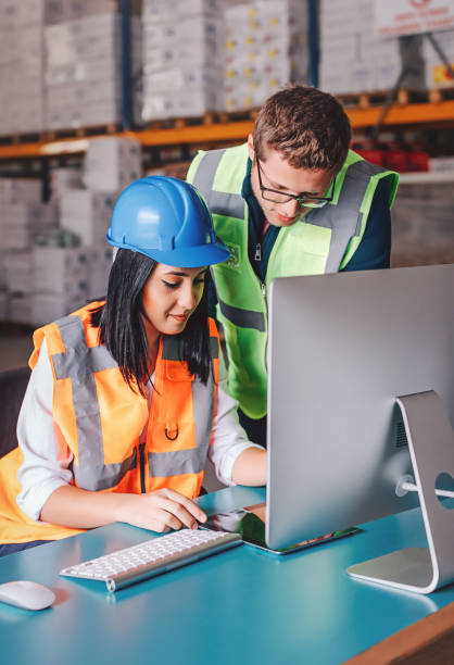 istock Business colleagues working with tablet computer in warehouse 939034872