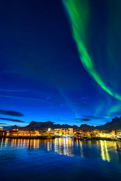 Northern Lights over Svolvaer in the Lofoten in Northern Norway Northern Lights over Svolvaer in the Lofoten in Northern Norway. Svolvaer is an important fishing port, but is becoming more and more a tourist town during summer and winter. harbor of svolvaer in winter lofoten islands norway stock pictures, royalty-free photos & images