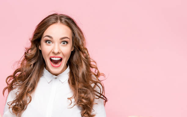 Surprised happy beautiful woman looking in excitement