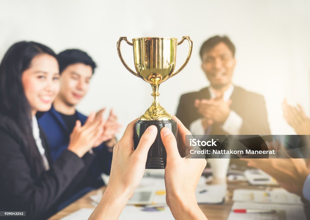 Businessman show thumbs up with trophy, reward, winner, champion and successful for business Award Stock Photo