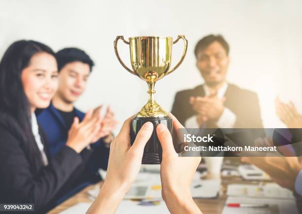 Businessman Show Thumbs Up With Trophy Reward Winner Champion And Successful For Business Stock Photo - Download Image Now