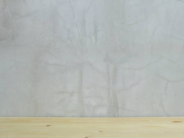 istock space of concrete wall and wooden floor 939043994