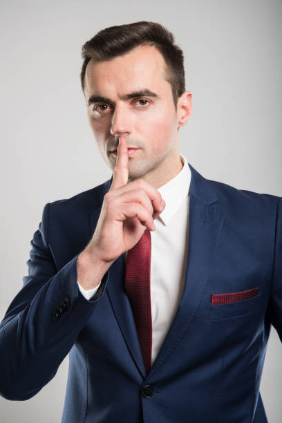 istock Attractive business man making sush gesture with finger 939047928