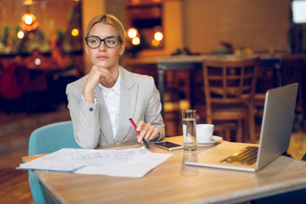 istock Businesswoman working in cafe 939050538