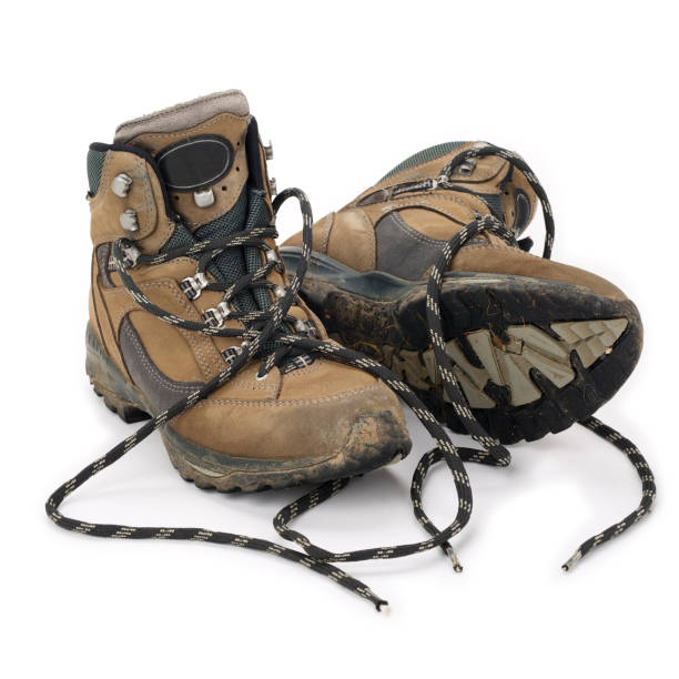 istock Used hiking boots isolated on white background 939051970