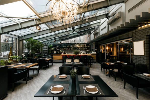 istock view of stylish empty cafe with arranged tables and chairs for visitors 939055280