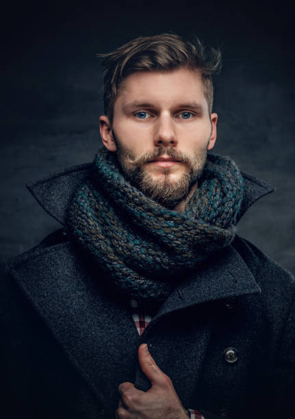 istock A man in a jacket and scarf. 939060676