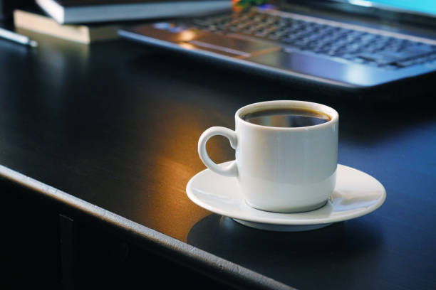 istock Coffee for work with laptop background 939060750
