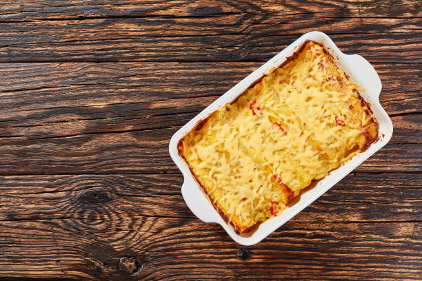 hot homemade enchiladas in baking dish