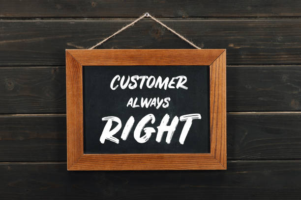 istock Board with lettering customer always right hanging on wooden wall 939065426