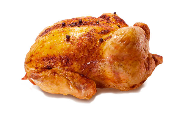 istock Roasted whole chicken on a white isolated background 939065762