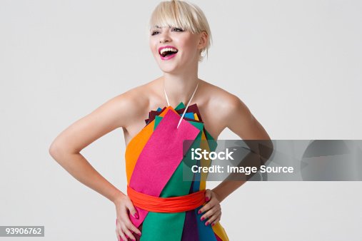 istock Young woman in dress made of coloured ribbons 93906762