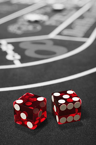 Dice on a craps table  dice photos stock pictures, royalty-free photos & images