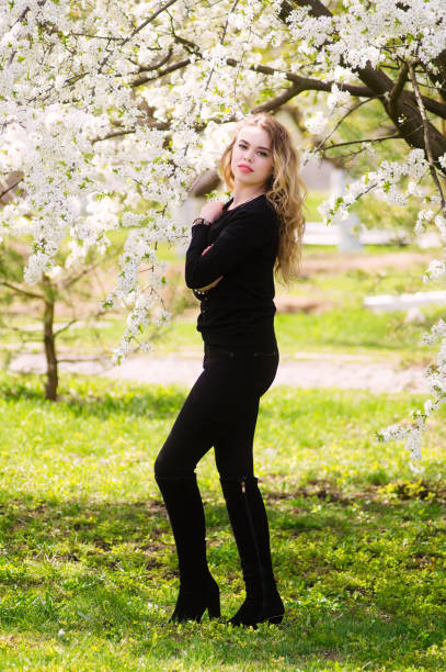 istock Young beautiful girl dressed in black jacket and black pants. 939080108