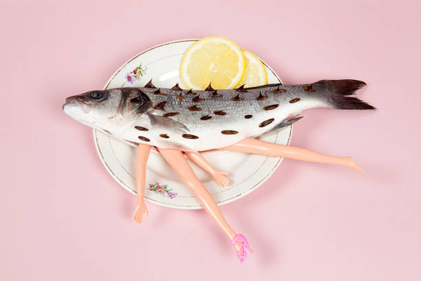 istock lemon fish pink plate doll and thorns 939081538