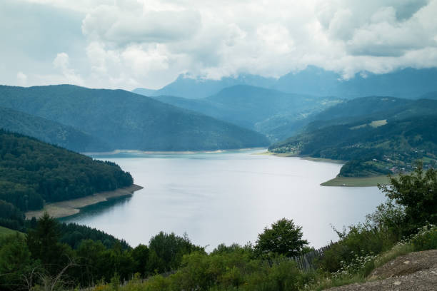 istock Cloudy landscape view from Lake Bicaz in Romania 939081898