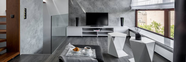 istock Tv living room with staircase 939084954