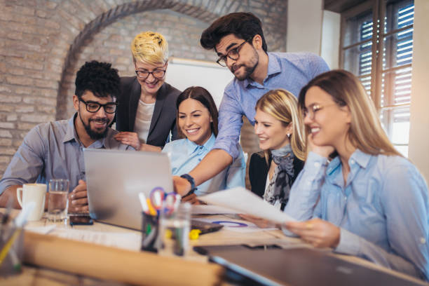 istock Business people working in office together. Team work in office. 939086648