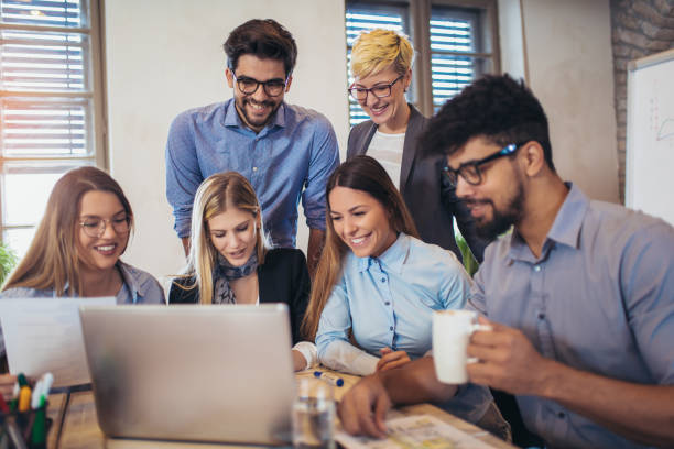 istock Business people working in office together. Team work in office. 939089230