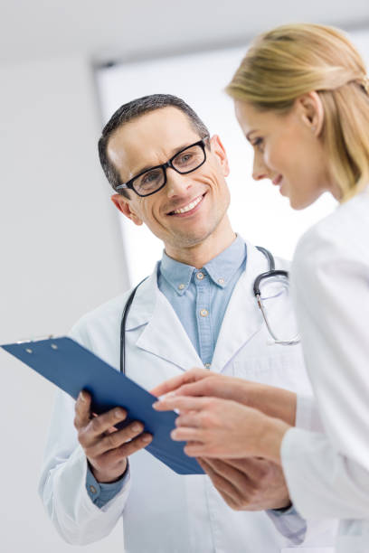 istock two doctors discussing diagnosis in hospital 939090732