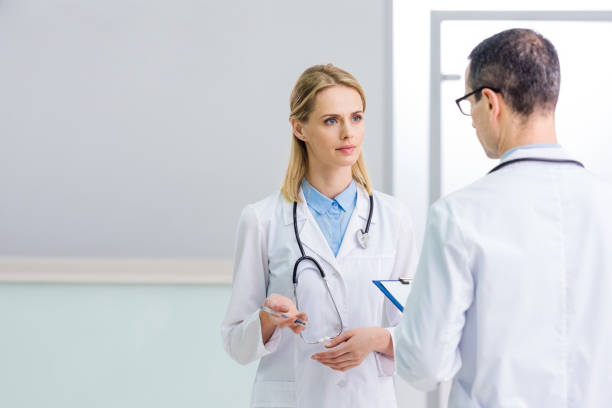 istock two doctors in white coats discussing diagnosis in clinic 939091132
