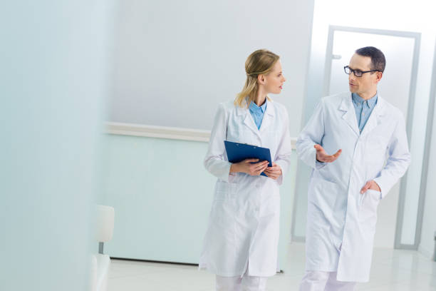istock two doctors in white coats discussing diagnosis in hospital 939091468