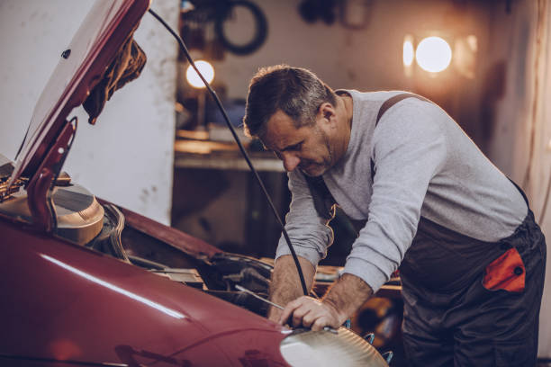 istock Senior car mechanic working in garage 939098934