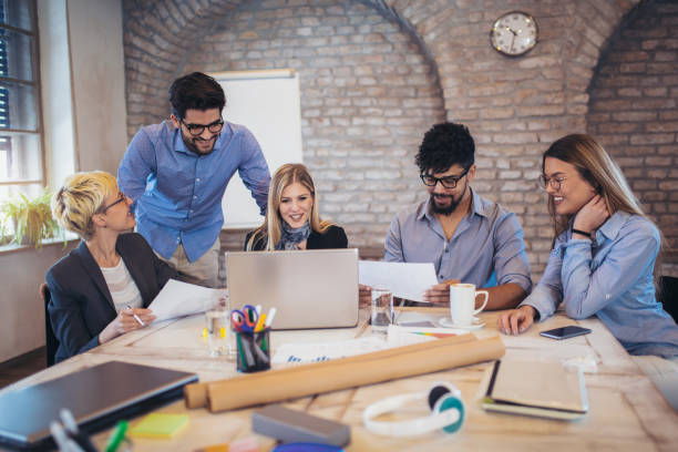istock Business people working in office together. Team work in office. 939099874