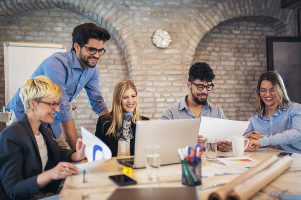 istock Business people working in office together. Team work in office. 939102168