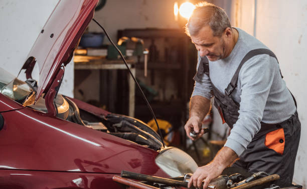 istock Senior mechanic in garage 939103152