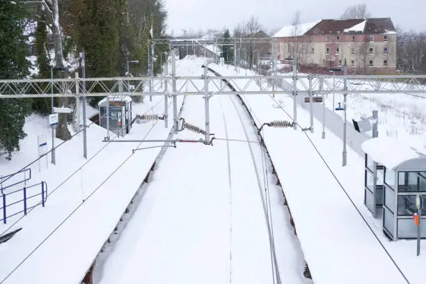 Railway covered in white snow cancelled train service in winter for safety of people and passengers