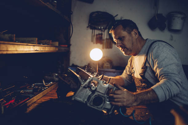 istock Senior car mechanic examining motor vehicle 939107814