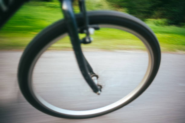 istock High Angle Blurred Motion Of Bicycle Moving On Road 939112076