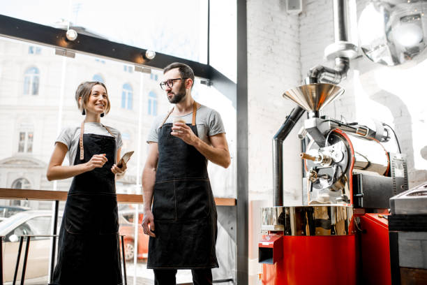 istock Baristas talking in the coffee shop 939112244