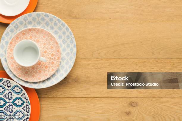 Empty Vintage Plates And Coffee Cup On Natural Wood Top View Stock Photo - Download Image Now