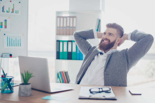 istock Smiling happy bearded man in gray jacket relaxing after having a conversation with international partners 939116224